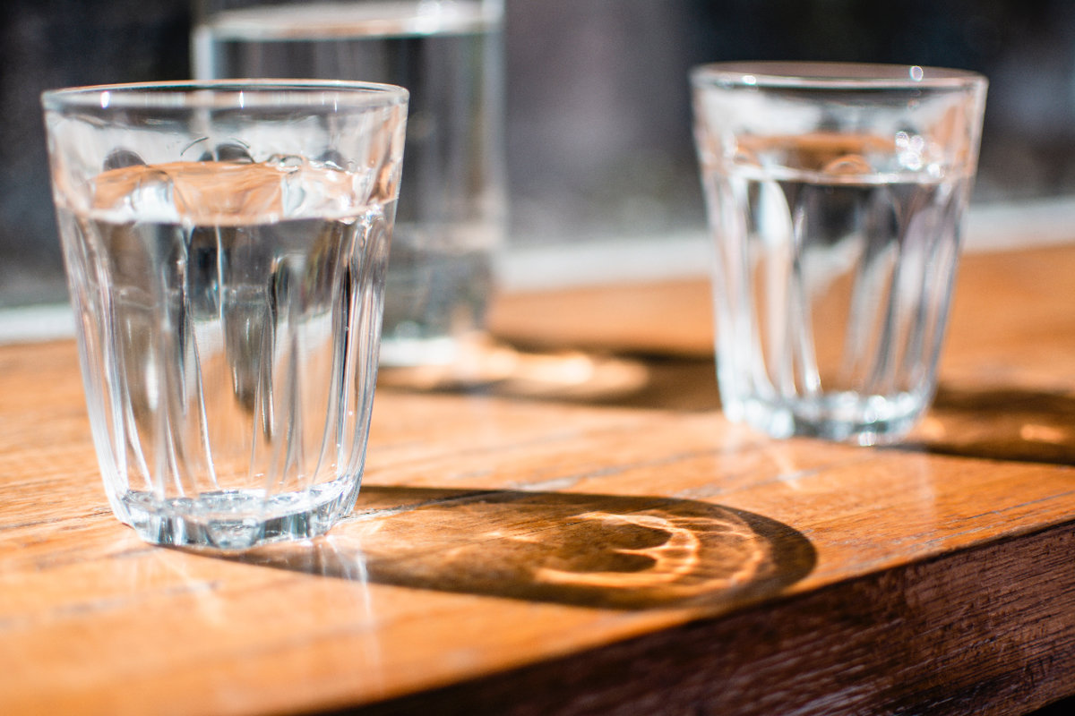 3 water glasses on a table